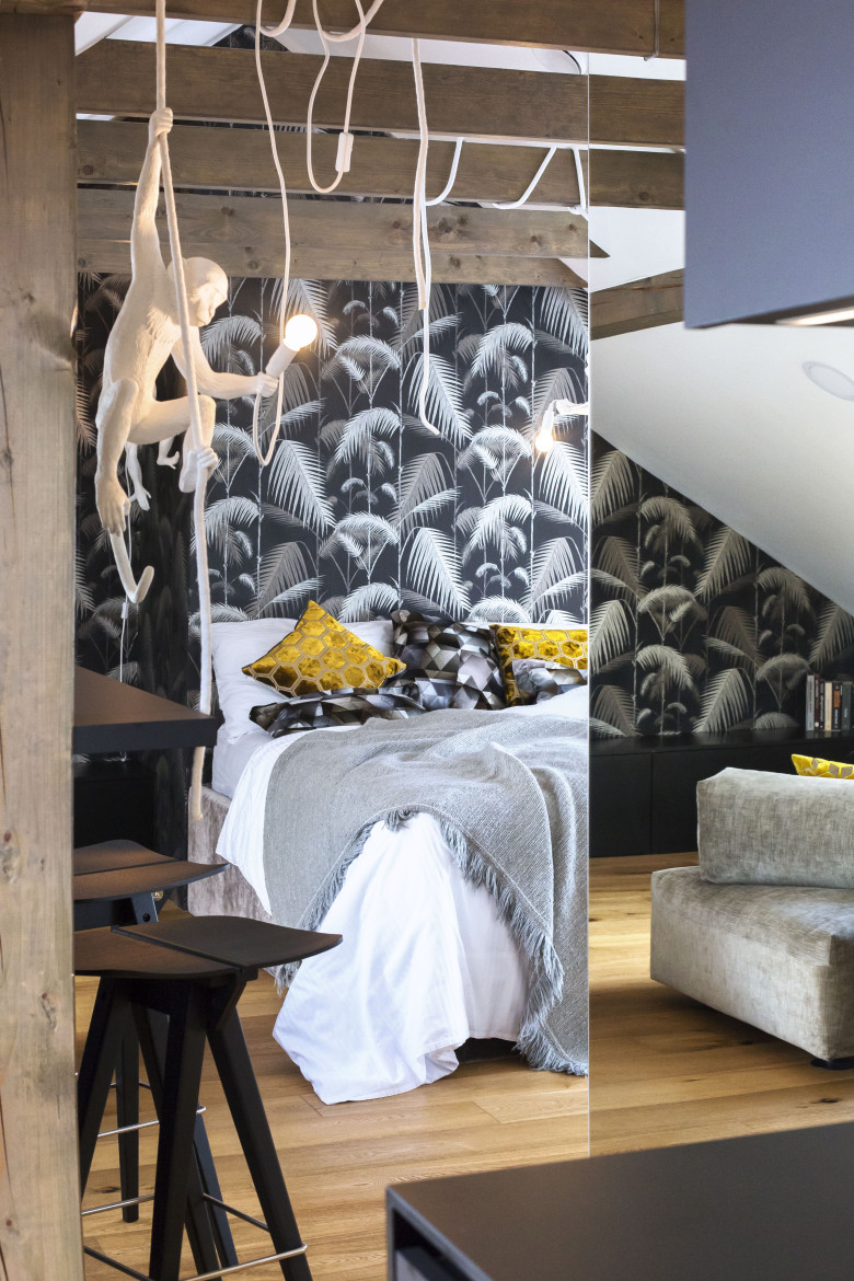 monkey-business-bedroom-wallpaper-and-yellow-accent-cushions